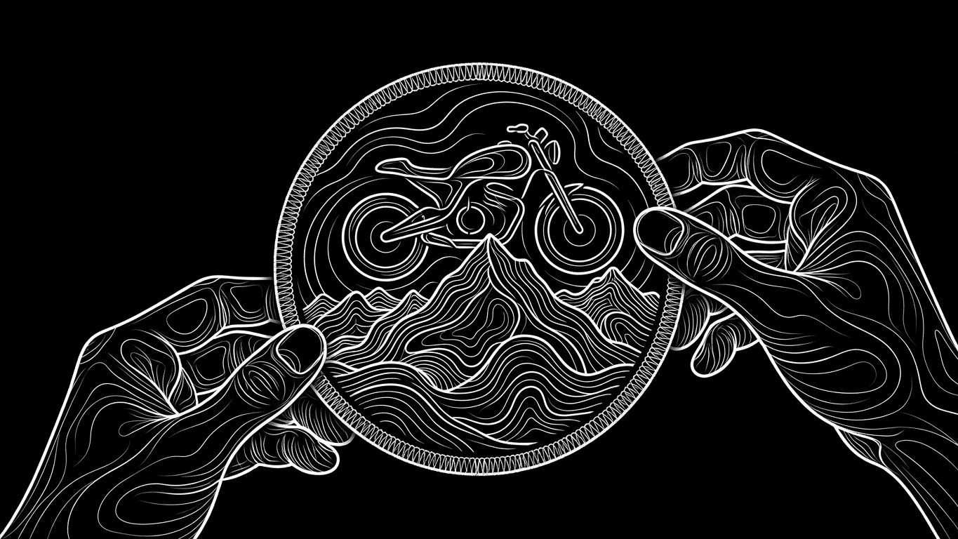 Close-up of hands holding a circular custom patch with mountain and motorcycle embroidery.